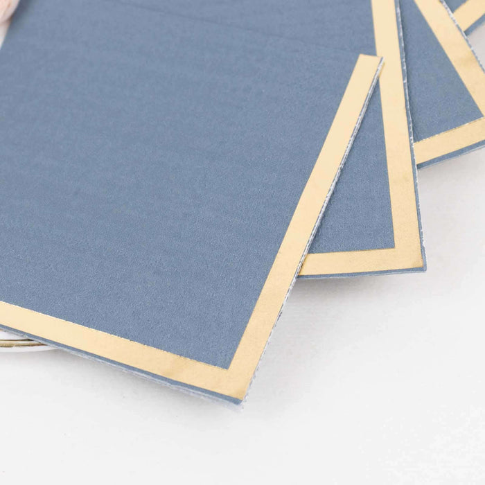Blue stationery with gold foil edges on a plain background.