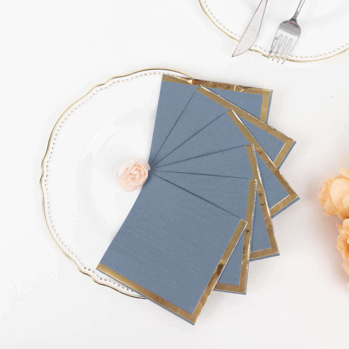 Blue notecards with gold trim on a decorative plate, styled with a pink flower.