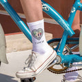 Heart shaped frame design personalized with your own photo and text on white cotton crew socks.