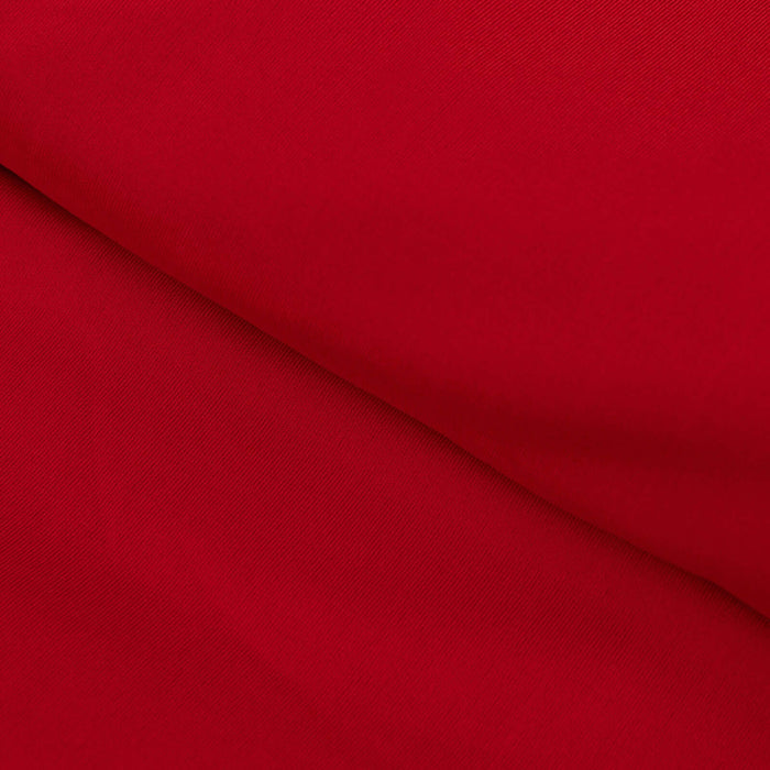 Vibrant red fabric texture close-up shot.