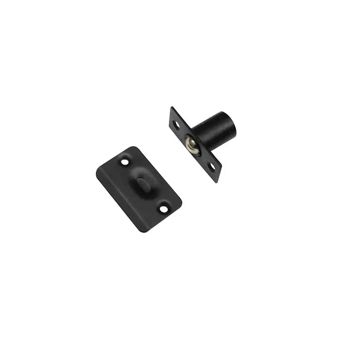 Two black metal door catch components from Taymor Industries are shown: a zinc die-cast body ball catch with mounting plate and a stamped steel strike plate, both designed for adjustable latch installation on cabinets or doors.