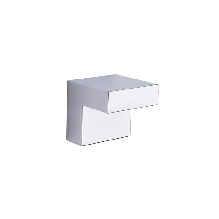 A modern Taymor Industries L-shaped wall hook, chrome-finished with clean lines and a minimalist design, crafted from durable zinc die-cast and 1 inch wide, set against a plain white background.