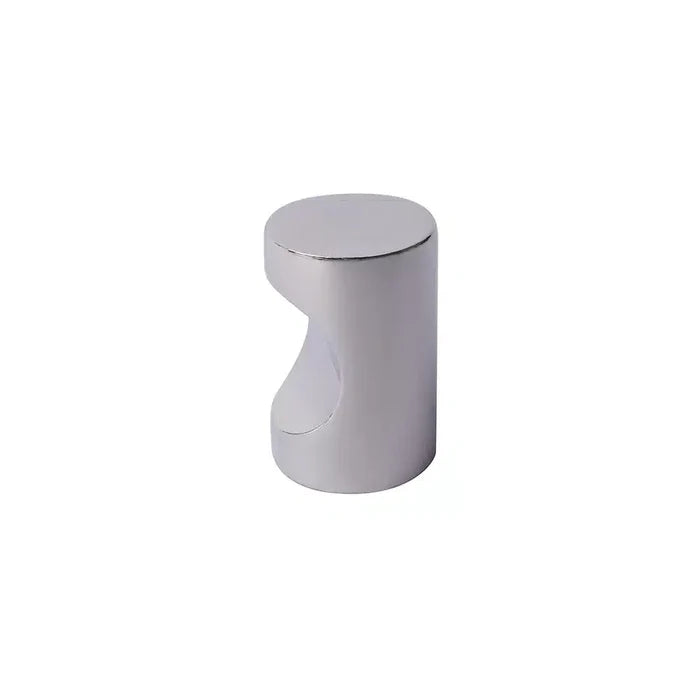 A small, cylindrical, silver-colored metal object by Taymor Industries, featuring a round top and a curved cutout on one side.