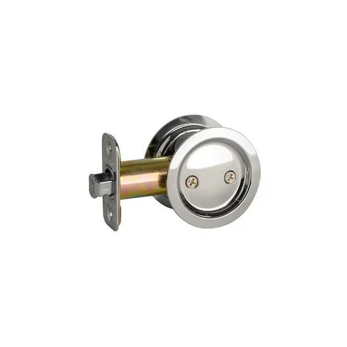 A round, silver-colored Taymor Industries pocket door lock with a recessed handle and reversible latch, shown at an angle on a white background.