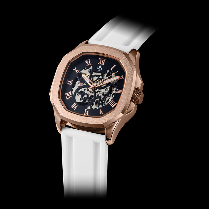 Men's luxury watch featuring a White Silicone Strap With Rose Gold Buckle, rose gold case, black dial with Roman numerals, and intricate skeleton design, bold by design.
