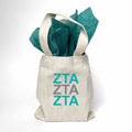 Sorority greek letters printed in sorority colors on natural canvas mini tote gift bag.