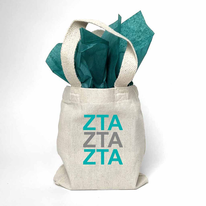 Sorority greek letters printed in sorority colors on natural canvas mini tote gift bag.